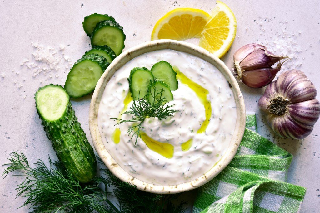 Tzatziki sauce became popular in Greece and the broader Mediterranean region due to its refreshing and versatile nature. It was traditionally made with strained yogurt, cucumber, garlic, olive oil, and herbs, all of which were common ingredients in Greek and Mediterranean cooking.