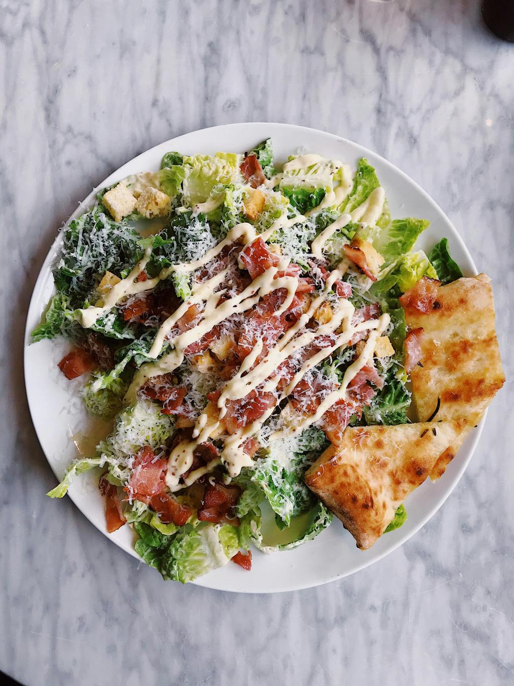 Caesar salad is a popular dish that originated in Mexico, despite its Italian-sounding name. It was created by an Italian immigrant named Caesar Cardini, who owned restaurants in Tijuana and San Diego. The salad gained fame in the 1920s and has since become a staple in many restaurants worldwide.