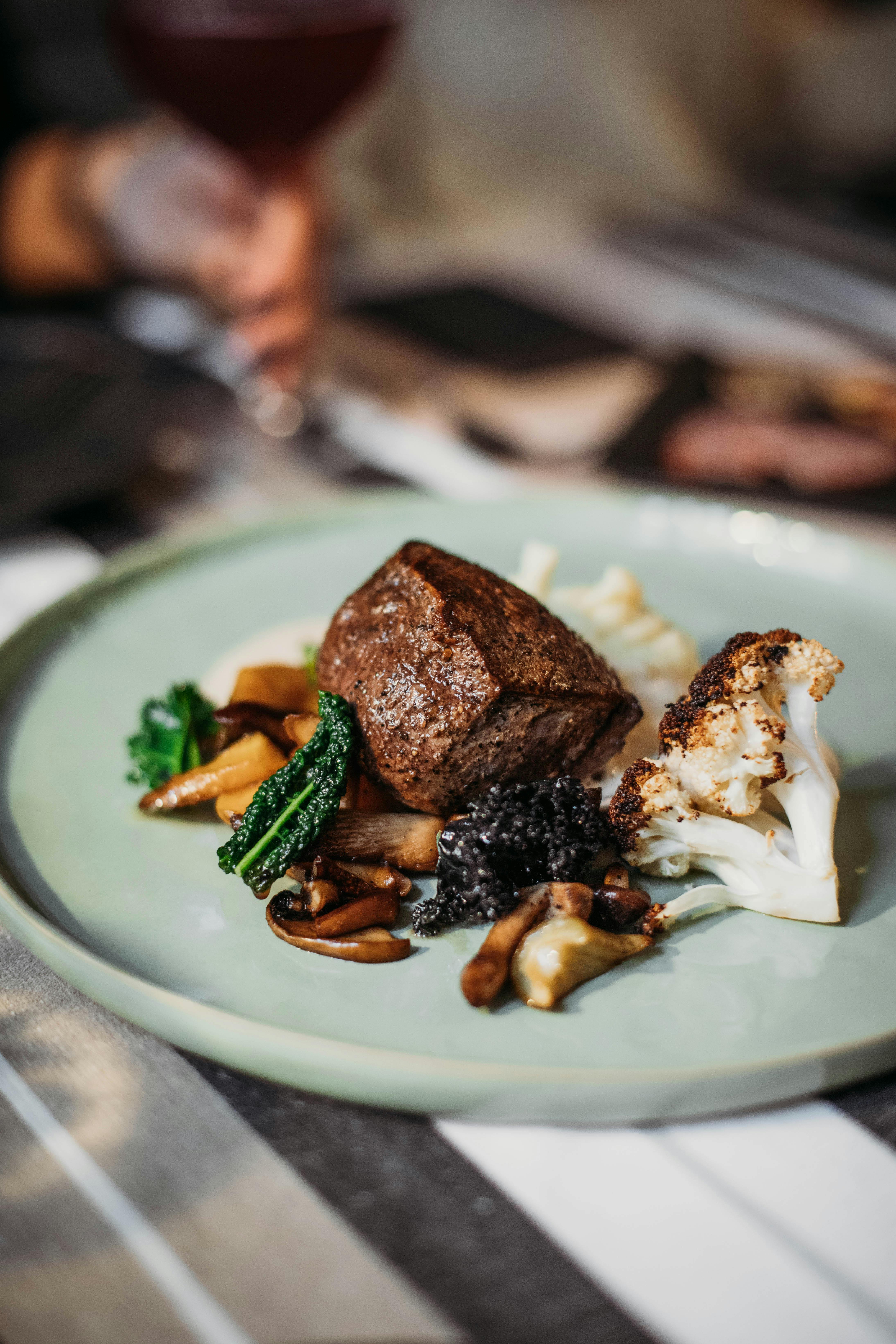 GRILLED TENDERLOIN TRUFFLED CELERIAC PUREE ZESTY KALE ROASTED MUSHROOM BURNT CAULI BEETS SAUCE